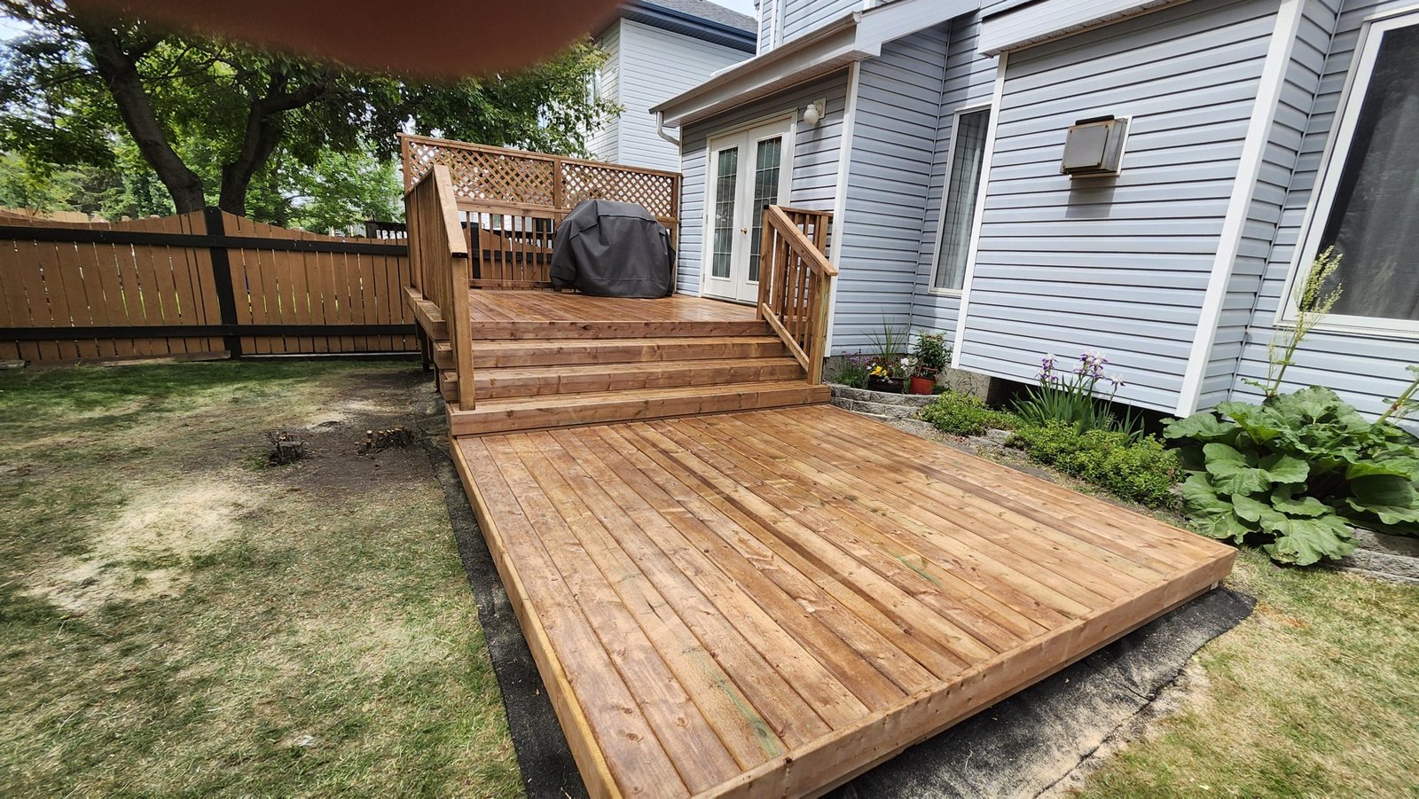 Two Level Wooden Deck with Wooden Railing