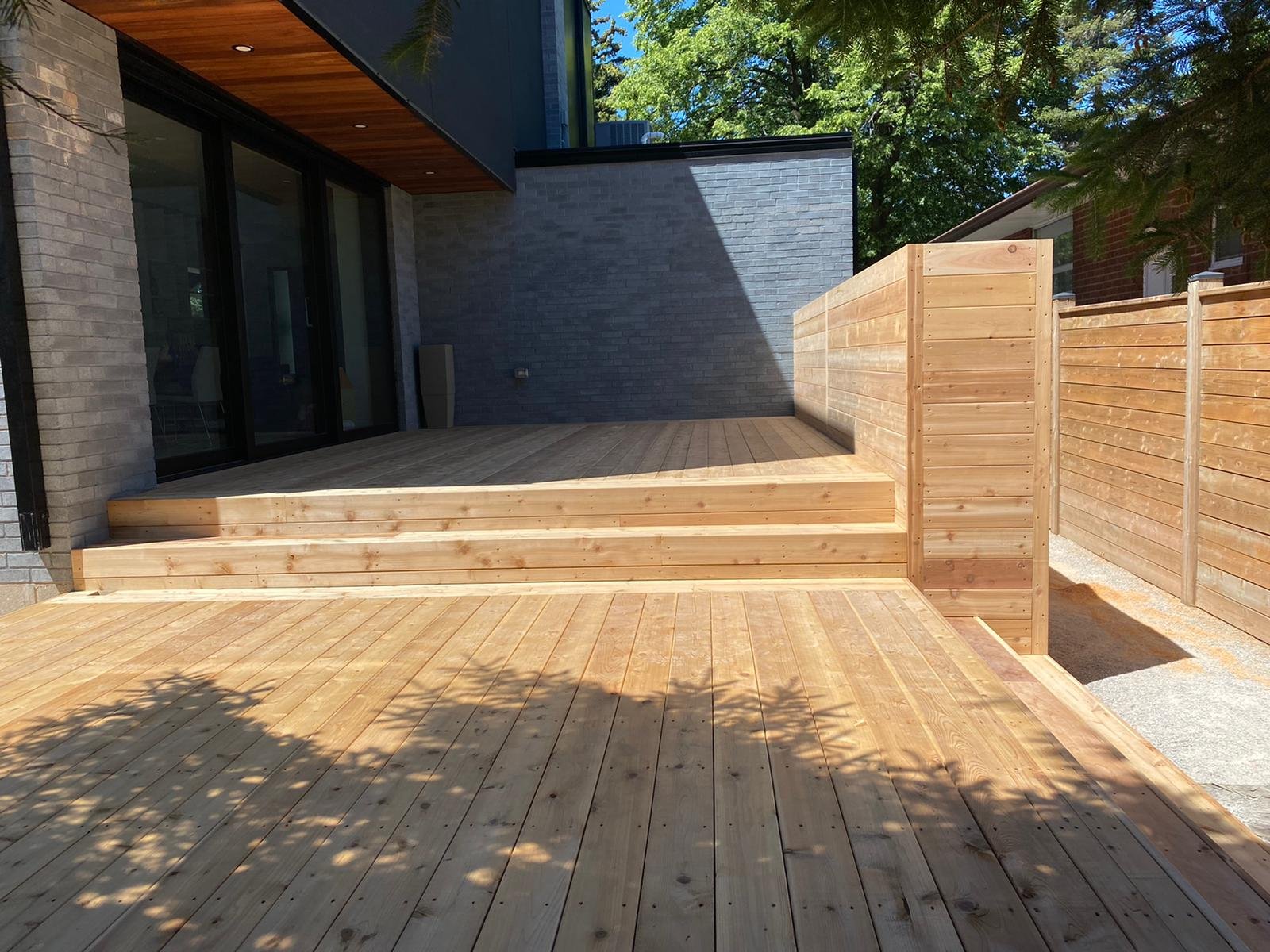 Bright Wooden Deck with Matching Fence